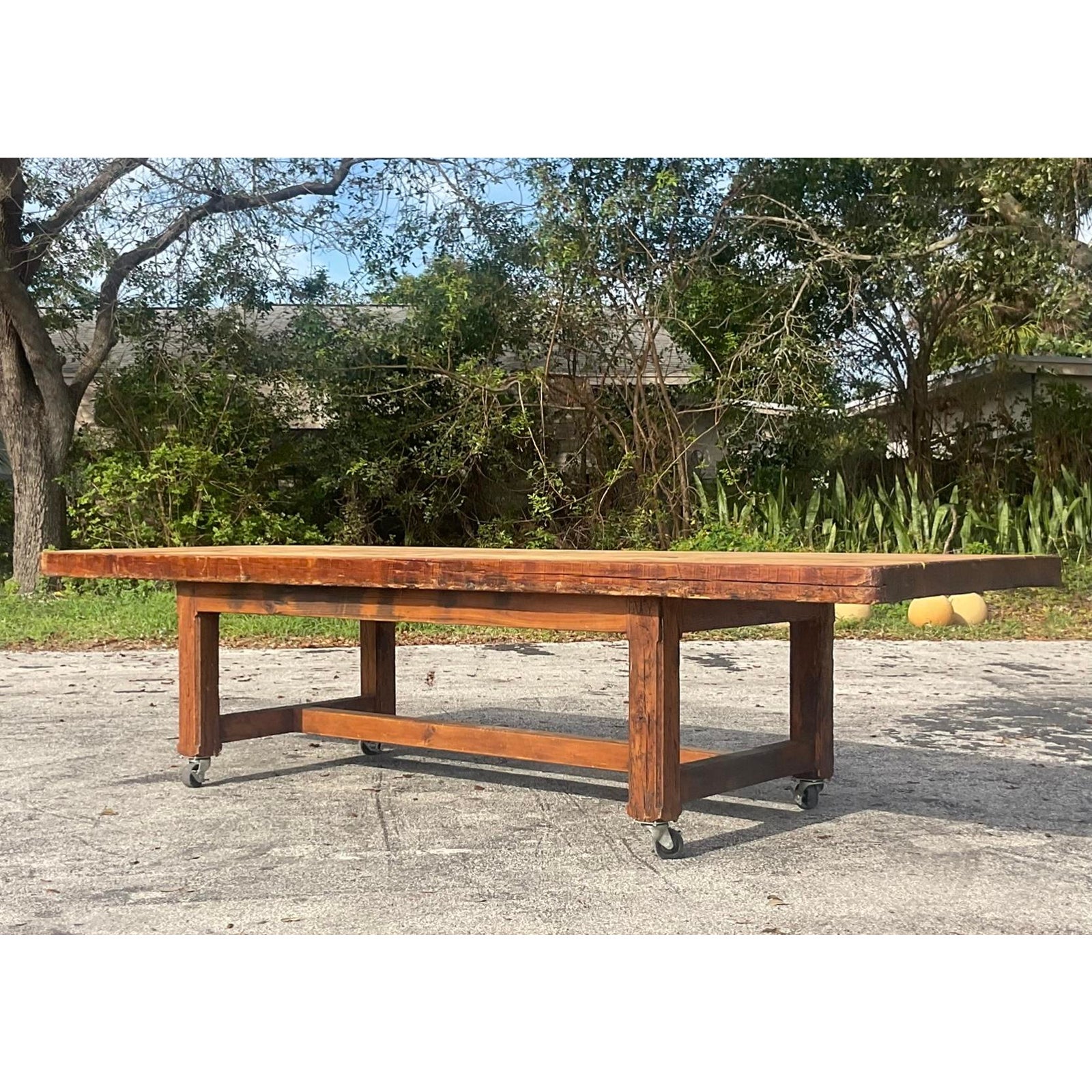Vintage Boho Monumental Industrial Plank Dining Table on Casters - Side view