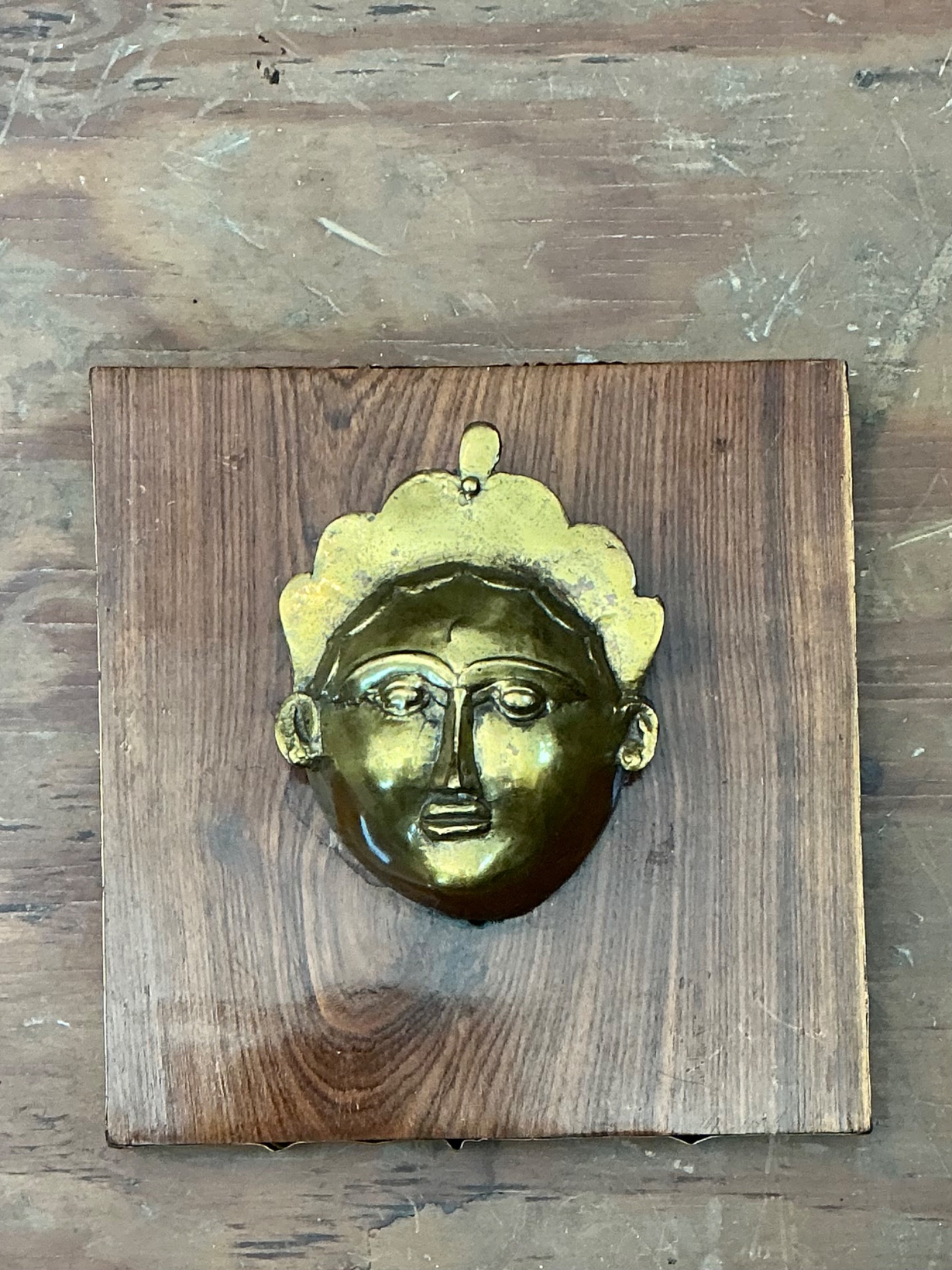 Vintage Brass Mask Mounted on Wood - Top view
