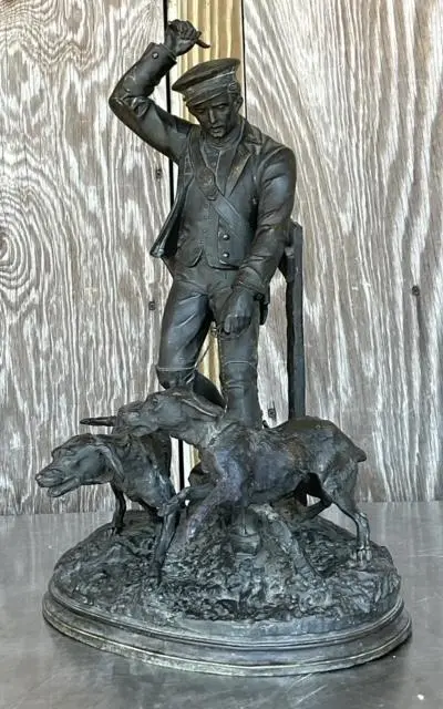 Vintage Boho Patinated Metal Man With Hounds Sculpture - Side view