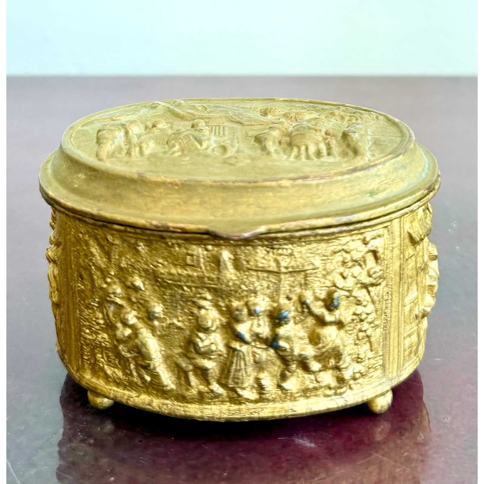 Vintage Embossed Metal Trinket Box With Festive Village Scene - Detail view