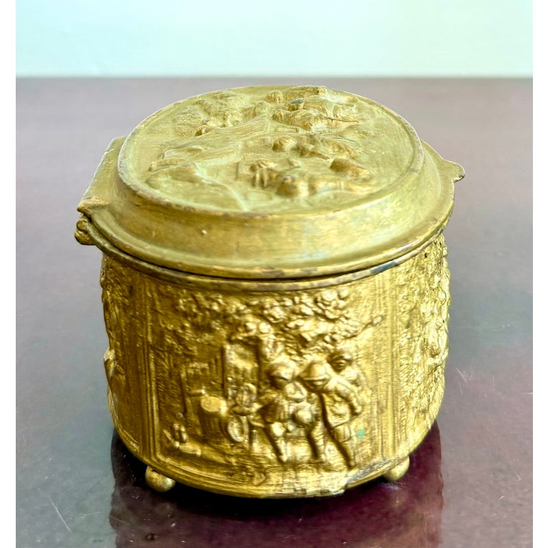 Vintage Embossed Metal Trinket Box With Festive Village Scene - Top view